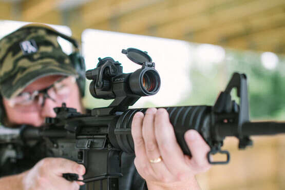 The Primary Arms advanced red dot sight attached to an M4 style rifle